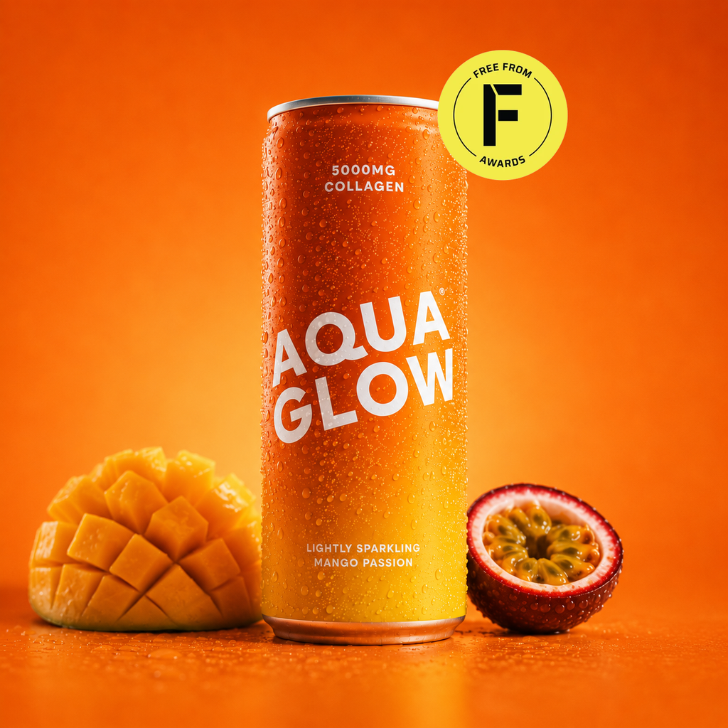 A can of Aqua Glow lightly sparkling mango passion fruit drink on an orange background, flanked by a sliced mango and a sliced passion fruit. A yellow 'Free From Awards' badge is in the top right corner.